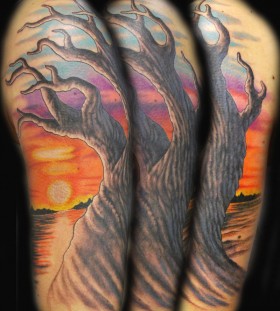 Sunset and tree tattoo