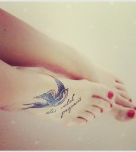 Swallow and quote foot tattoo