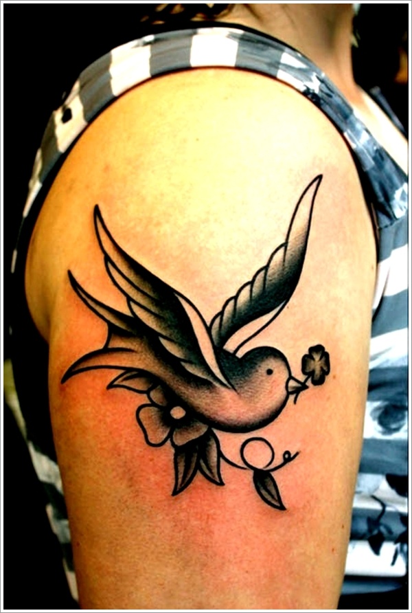 Swallow with a flower tattoo