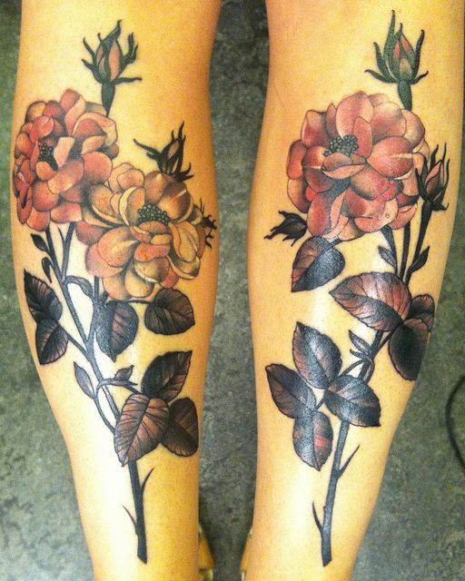 Sweet flowers leg tattoos by Amanda Leadman