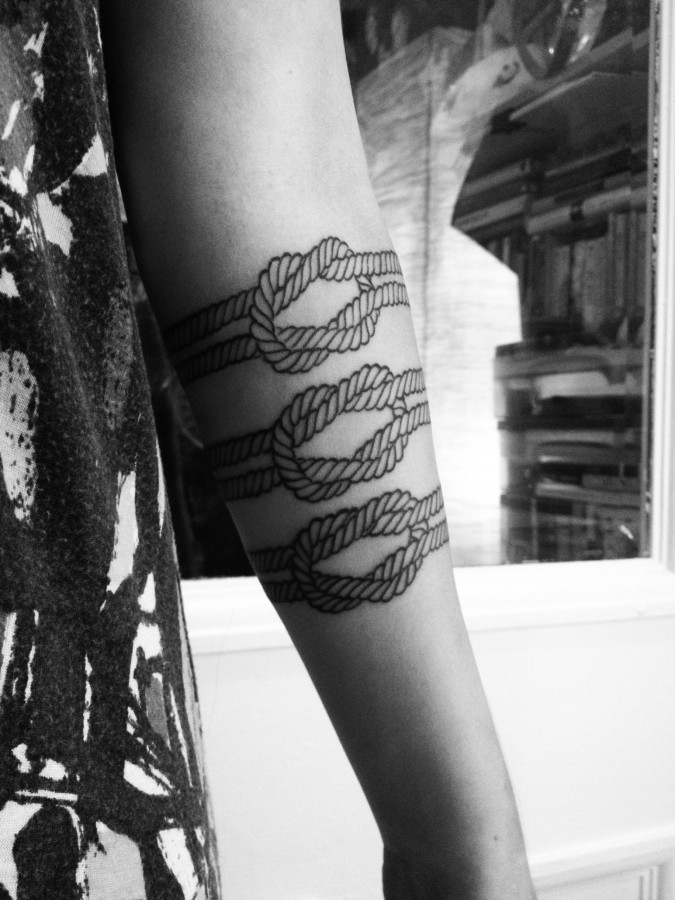 Sweet rope knot arm tattoo