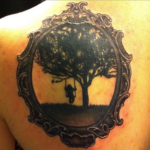 Swing on a tree frame tattoo