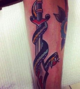 Sword and snake tattoo by Charley Gerardin