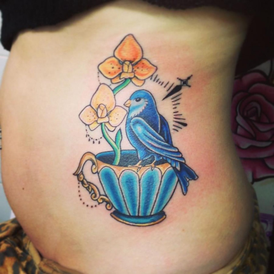 Teacup and blue bird tattoo