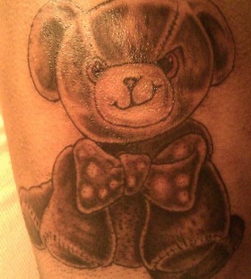Teddy with a bow tie tattoo