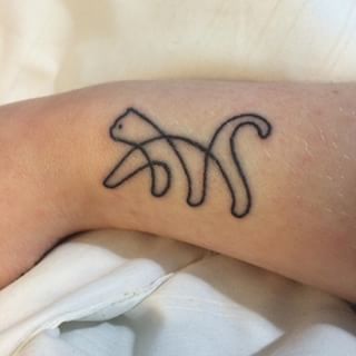 Abstract cat tattoo