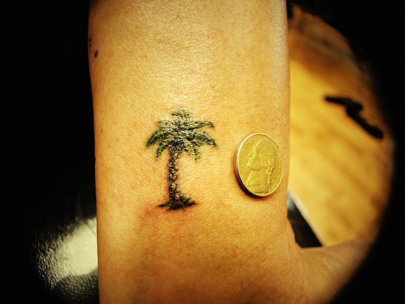 Tiny palm tree tattoo