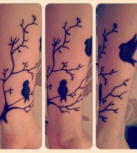 Tree branch and birds tattoo