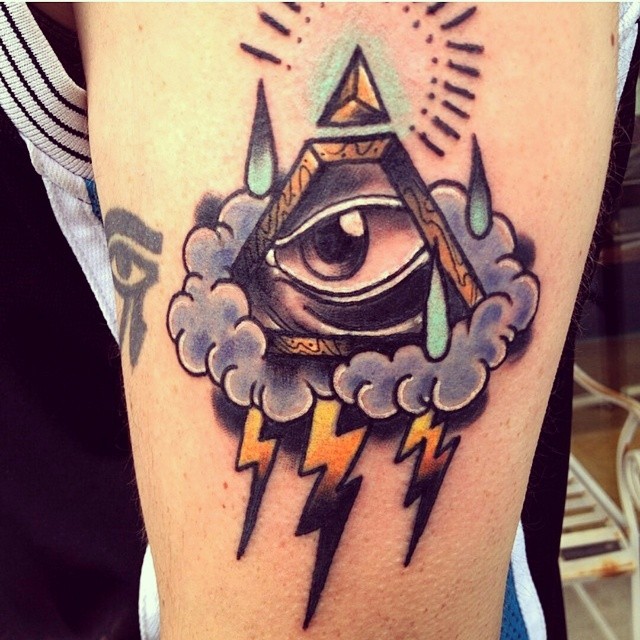 Triangle eye and lightning tattoo
