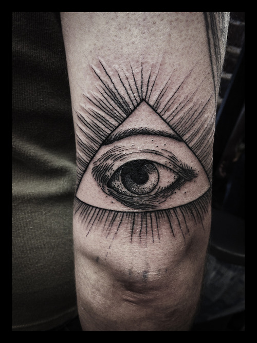 Triangle eye tattoo on arm