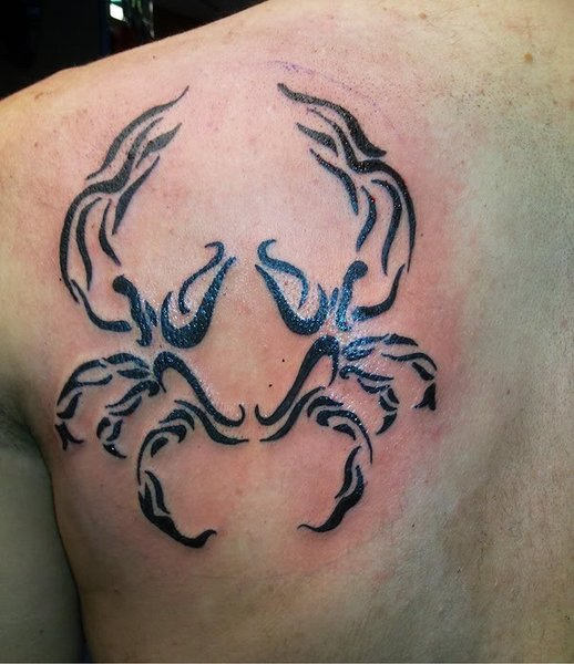 Tribal crab back tattoo