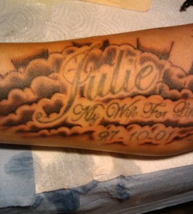 Tribute cloud arm tattoo