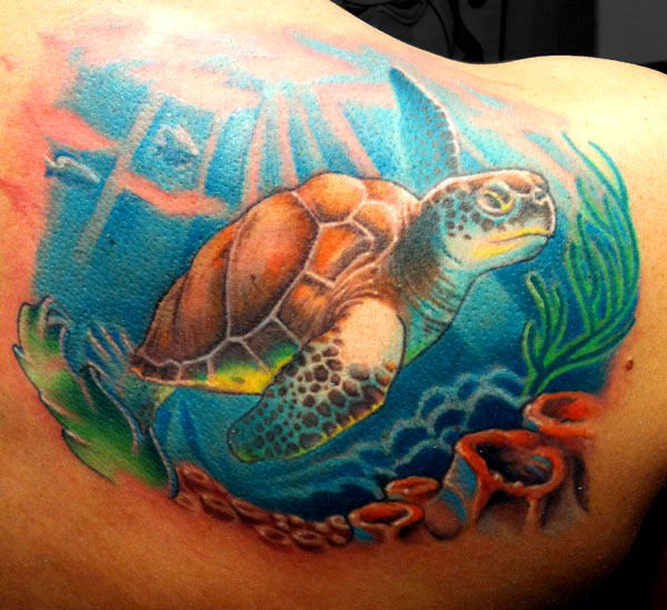 Turtle in the ocean tattoo