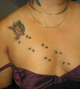 Turtle paws chest tattoo