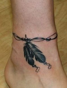 Two feathers ankle tattoo