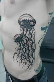 Two jellyfish side tattoo