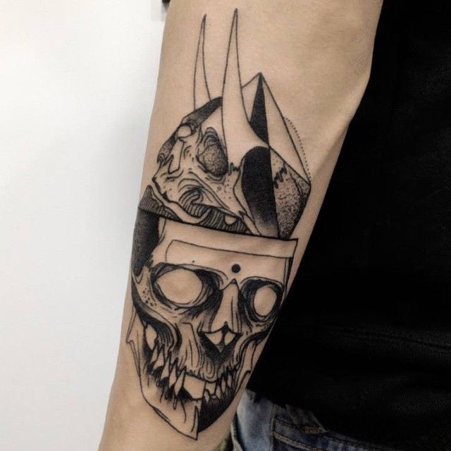 Two skulls tattoo by Michele Zingales