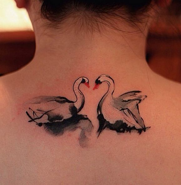 Two swans tattoo by Chen Jie