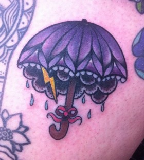 Umbrella and lightning bolt tattoo