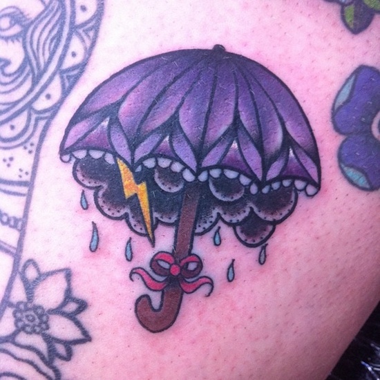 Umbrella and lightning bolt tattoo