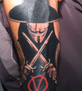 V with daggers arm tattoo