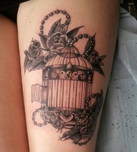 Vintage birdcage and flowers tattoo