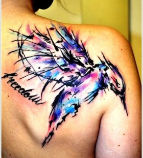 Watercolor style tribal bird tattoo