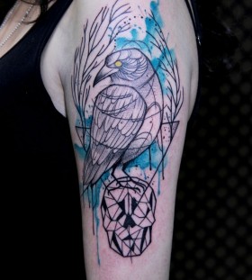 Watercolour crow on skull tattoo by Tyago Compiani