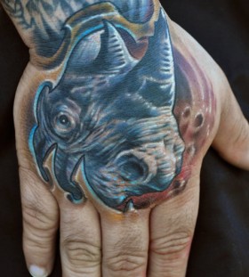 Weird rhino hand tattoo