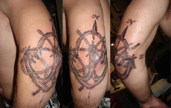 Wheel and anchor arm tattoo