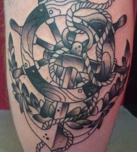 Wheel and anchor leg tattoo