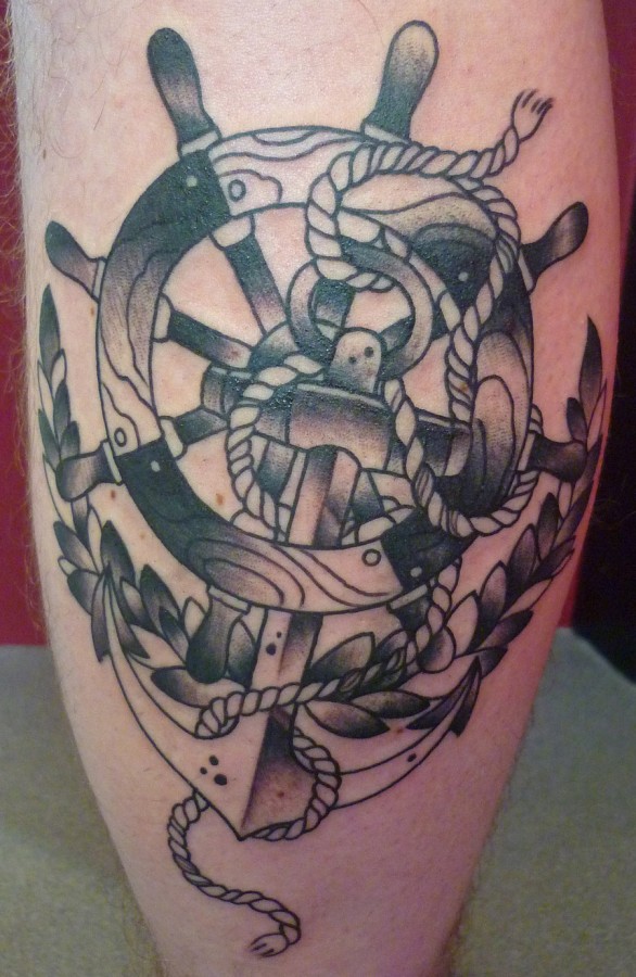 Wheel and anchor leg tattoo