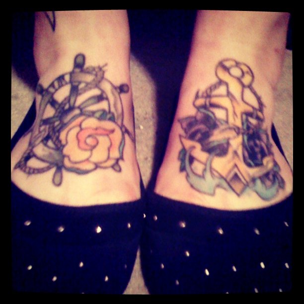 Wheel and rose foot tattoo