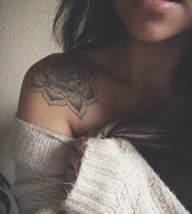 White and black shoulder tattoo