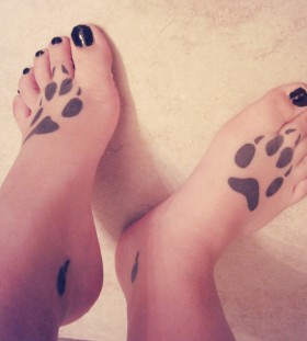 Wolf paws foot tattoo