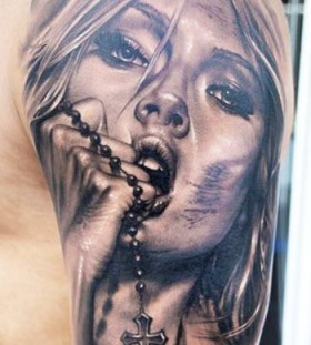 Woman with cross tattoo by James Tattooart