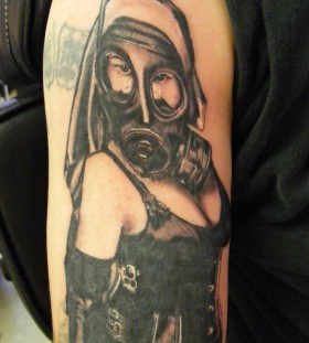 Woman with gas mask arm tattoo
