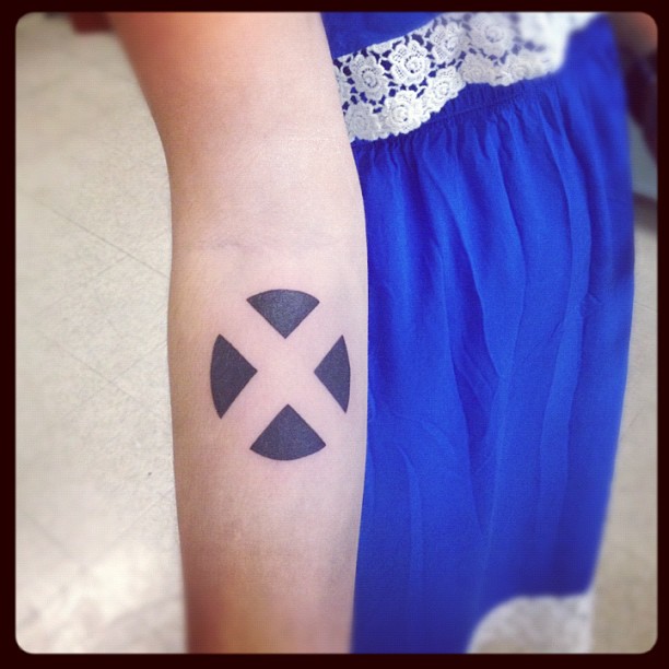 X-men symbol arm tattoo