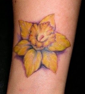 Yellow flower tattoo by Jessica Brennan