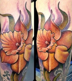 Yellow flower tattoo by Jon Mesa