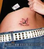 Simple Bird Tattoo Picture on Woman's Flank
