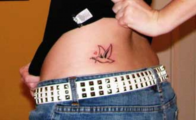Simple Bird Tattoo Picture on Woman’s Flank
