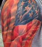 American Flag Draped Over Shoulder Tattoo Design