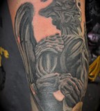 Angels And Demons Statue Tattoo On Arm Photos Gallery