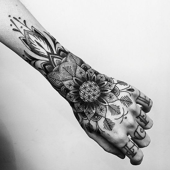 arm and hand flower tattoo