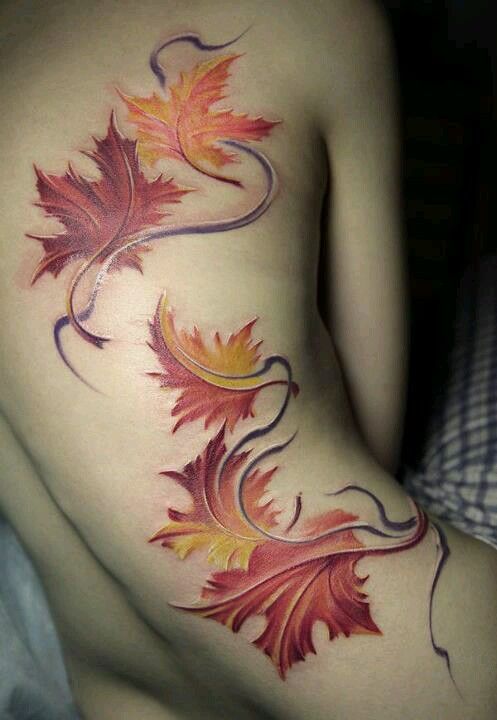 autumn-leaves-in-wind-tattoo-on-back