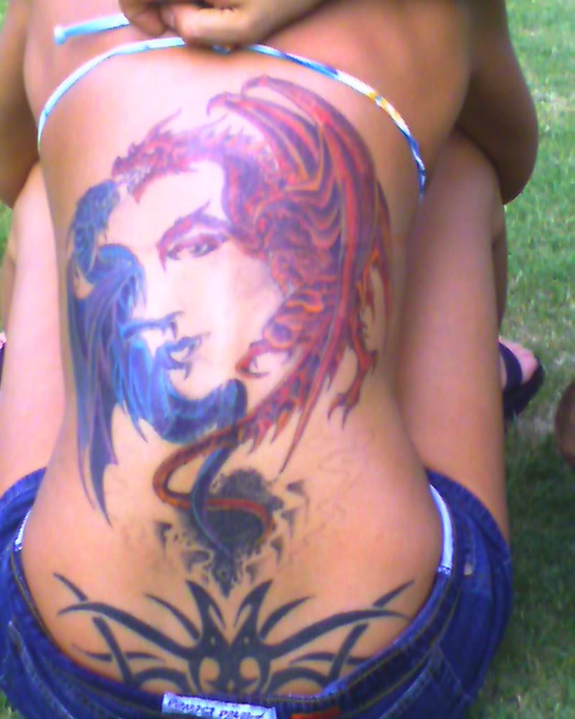 Great Tattoo Design on Upper Back for Girls