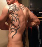 Athletic Body Man with Back Tribal Tattoos