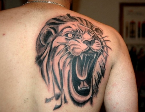 Lion Tattoo On Upper Back For Man