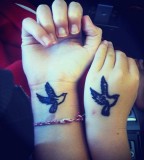 Lovely Duplicated Bird Tattoos On Hand And Wrist